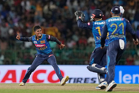  Jeffrey Vandersay celebrates the wicket of Shivam Dube 